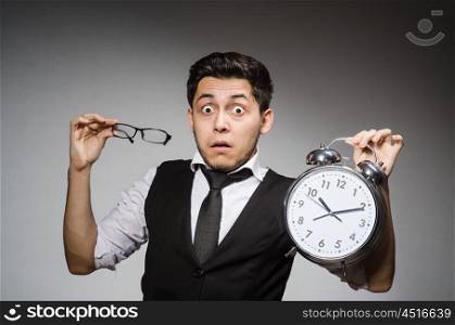 Businessman with clock in time concept