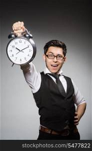 Businessman with clock in time concept
