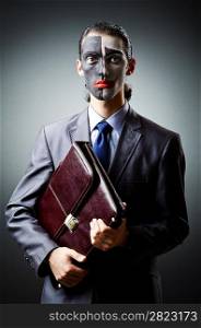 Businessman with clown face paint