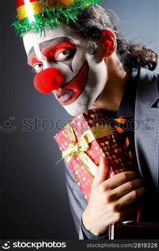 Businessman with clown wig and face paint