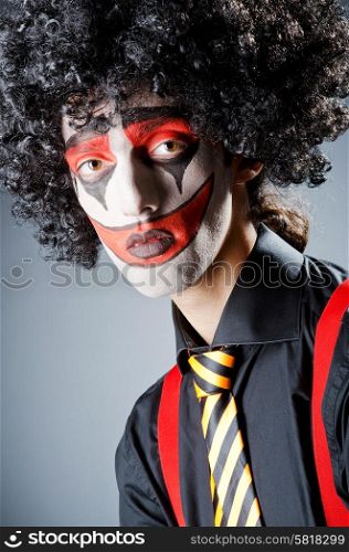Businessman with clown wig and face paint