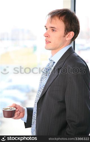 businessman with coffee and window