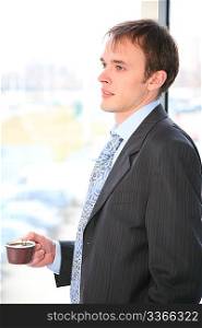 businessman with coffee and window