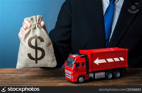 Businessman with dollar money bag and truck. High income of the transport business and the transport of goods. Good salaries for drivers. Rising prices, global containers shortage crisis. Logistics
