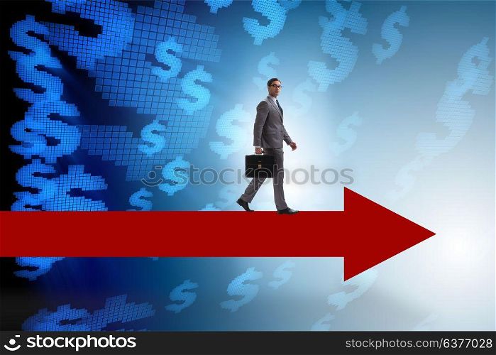 Businessman with dollar walking on arrow sign