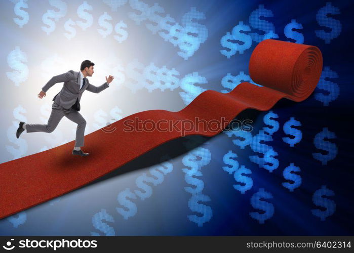 Businessman with dollars on red carpet