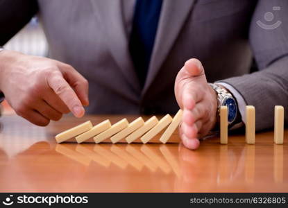 Businessman with dominoes in the office