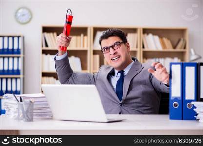 Businessman with dynamite in the office