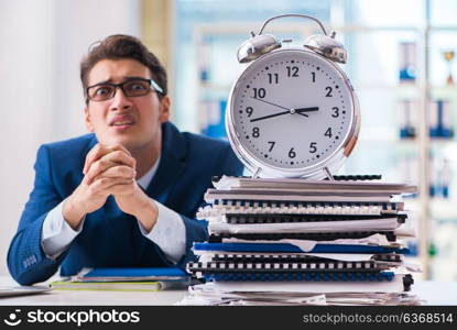 Businessman with giant clock failing to meet deadlines and missing them. Businessman with giant clock failing to meet deadlines and missi