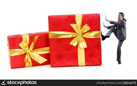 Businessman with gift boxes on white