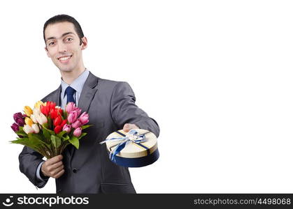 Businessman with giftbox and flowers