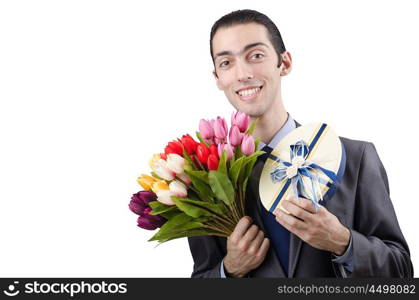 Businessman with giftbox and flowers