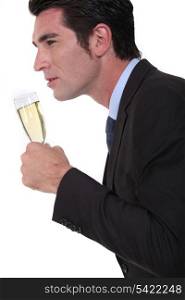 Businessman with glass of champagne