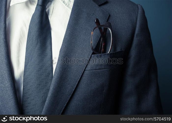 Businessman with glasses in his front pocket