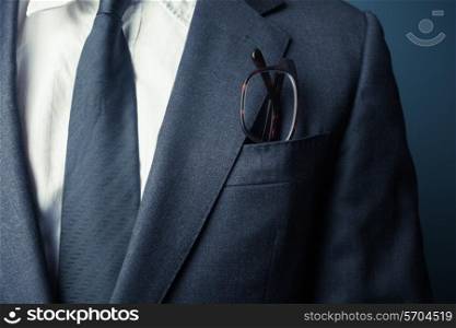 Businessman with glasses in his front pocket