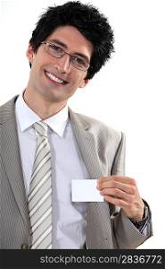 Businessman with glasses showing off business-card