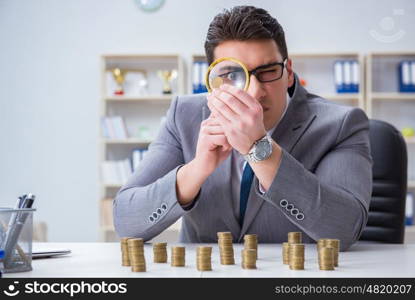 Businessman with golden coins in business growth concept