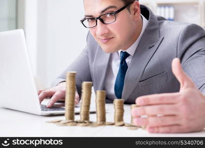 Businessman with golden coins in business growth concept