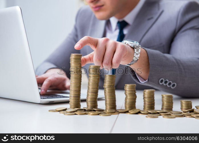 Businessman with golden coins in business growth concept