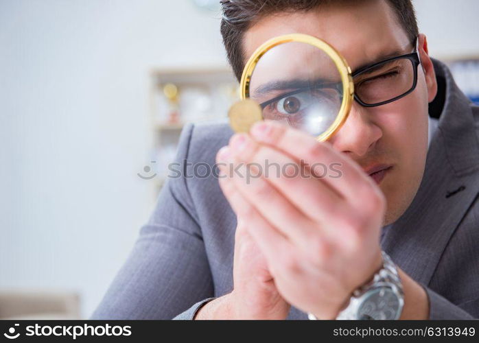 Businessman with golden coins in business growth concept