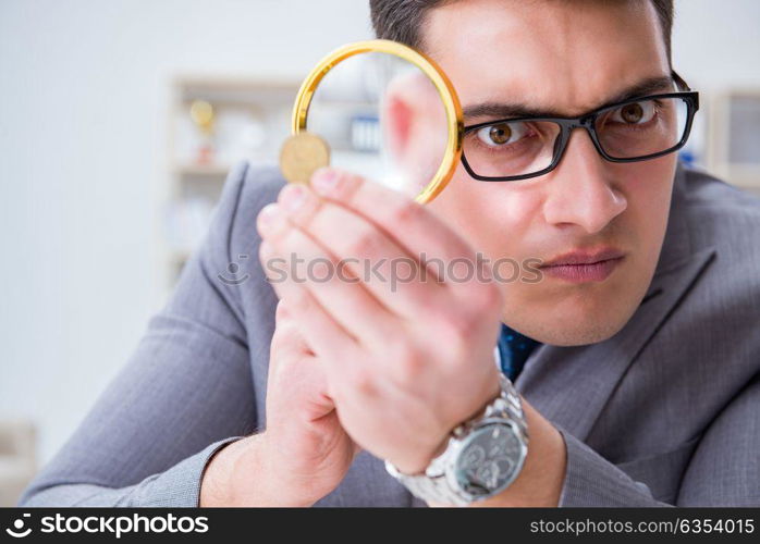 Businessman with golden coins in business growth concept