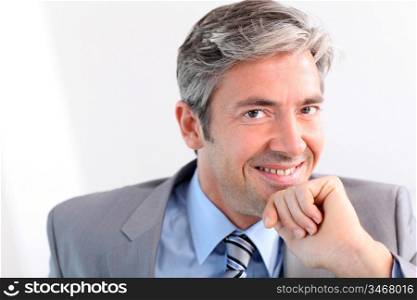 Businessman with hand on chin