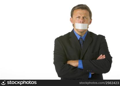 Businessman With His Arms Folded And His Mouth Taped Shut