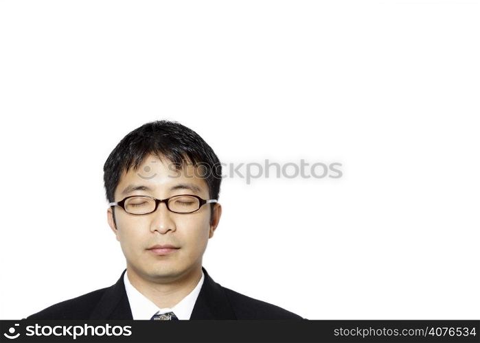 Businessman with his eyes closed