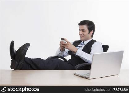 Businessman with his feet on the table