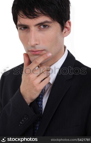 Businessman with his hand on his chin
