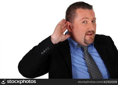 Businessman with his hand to his ear