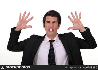 Businessman with his hands raised