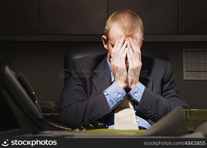 Businessman with his head in his hands