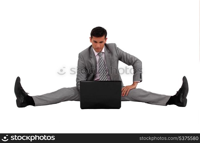 Businessman with his legs spread apart