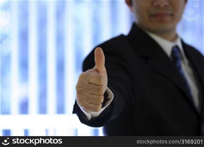 Businessman with his thumb up