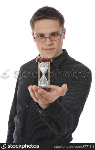 Businessman with hourglass in hand in a dark room. Isolated on white background