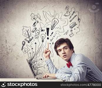 Businessman with ipad. Image of young businessman holding ipad against sketch background