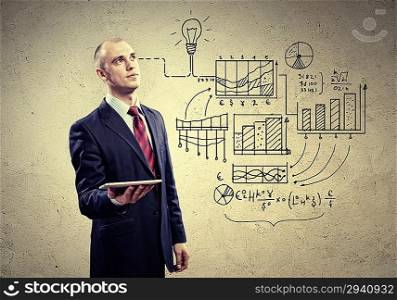 Businessman with ipad in hands