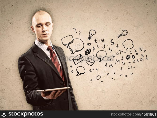 Businessman with ipad in hands. Image of businessman holding ipad in hands