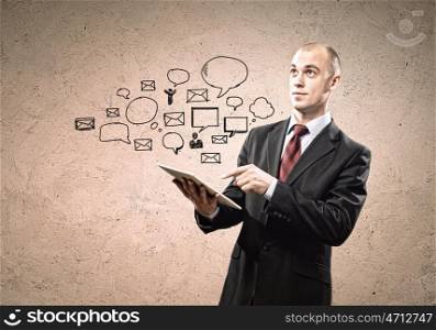 Businessman with ipad in hands. Image of businessman holding ipad in hands