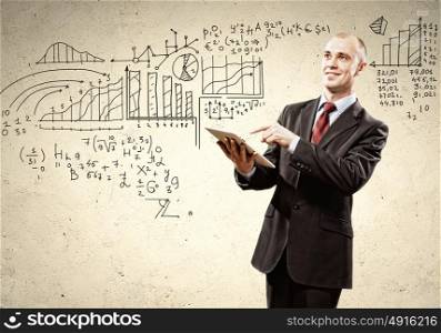 Businessman with ipad in hands. Image of businessman holding ipad in hands