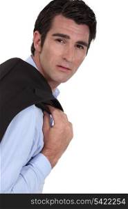 Businessman with jacket over his shoulder