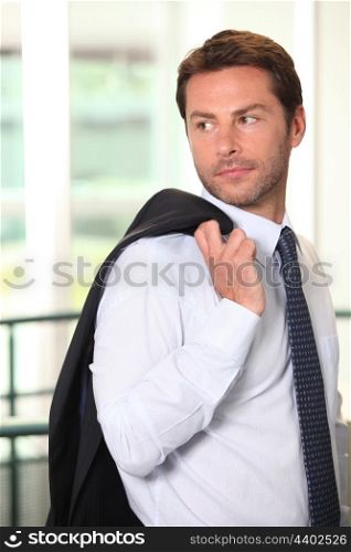 Businessman with jacket over shoulder