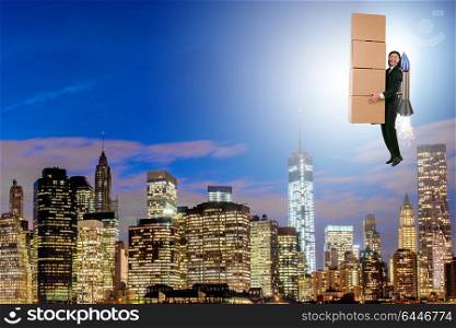 Businessman with jetpack delivering boxes globally