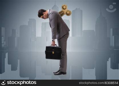 Businessman with key in hardworking concept