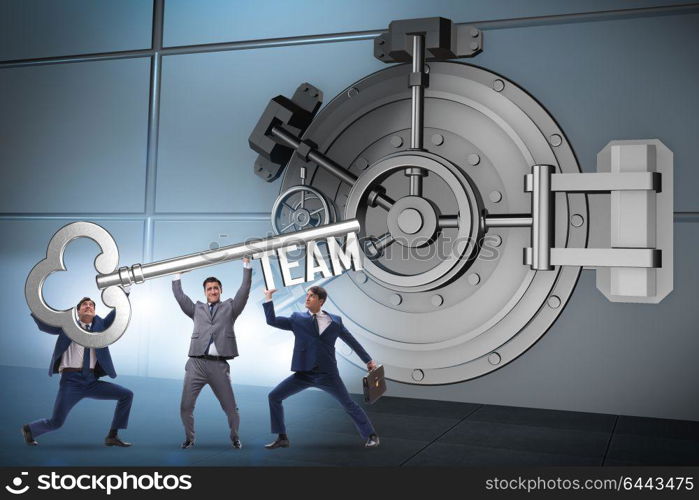 Businessman with key near bank vault door