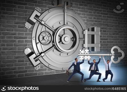 Businessman with key near bank vault door