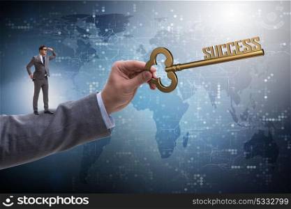 Businessman with key to success business concept