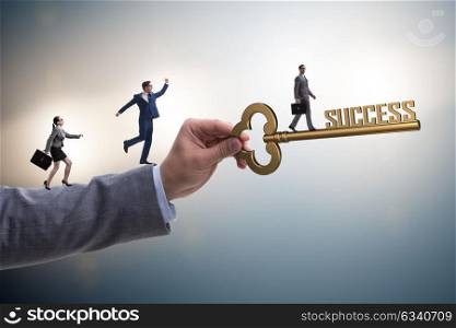 Businessman with key to success business concept. The businessman with key to success business concept