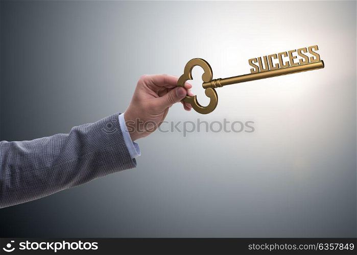 Businessman with key to success business concept. The businessman with key to success business concept
